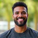 Professional headshot of Coach Michael Grant, a certified strength and conditioning specialist.